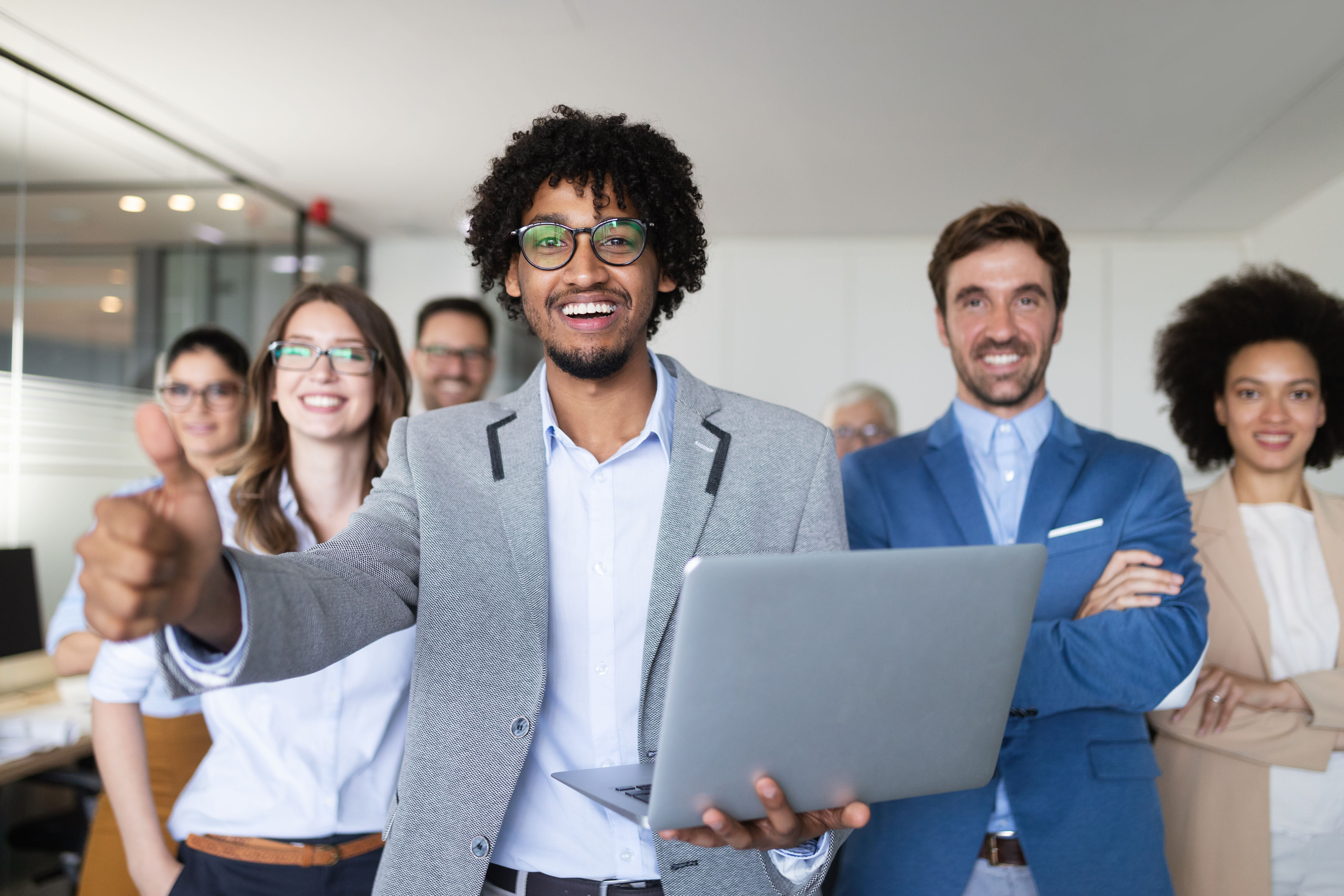 Successful company with happy workers in modern office
